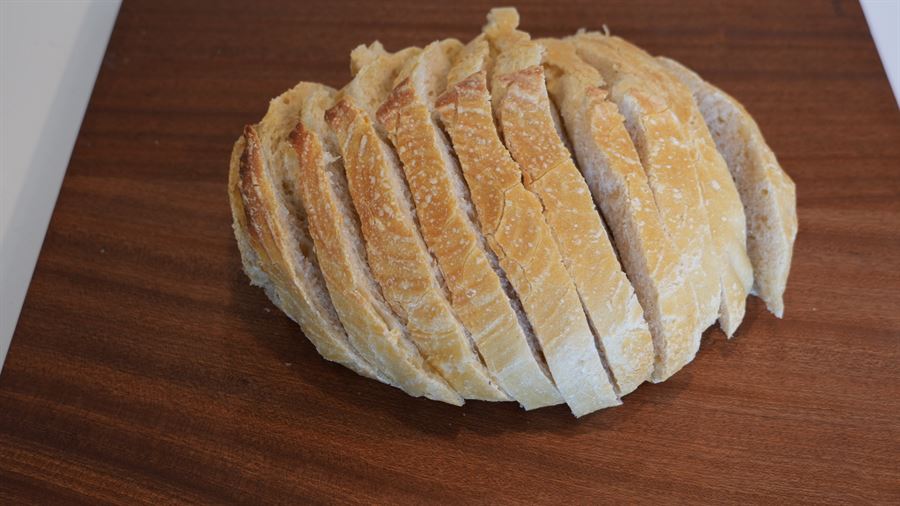 A sliced plain artisan sourdough loaf